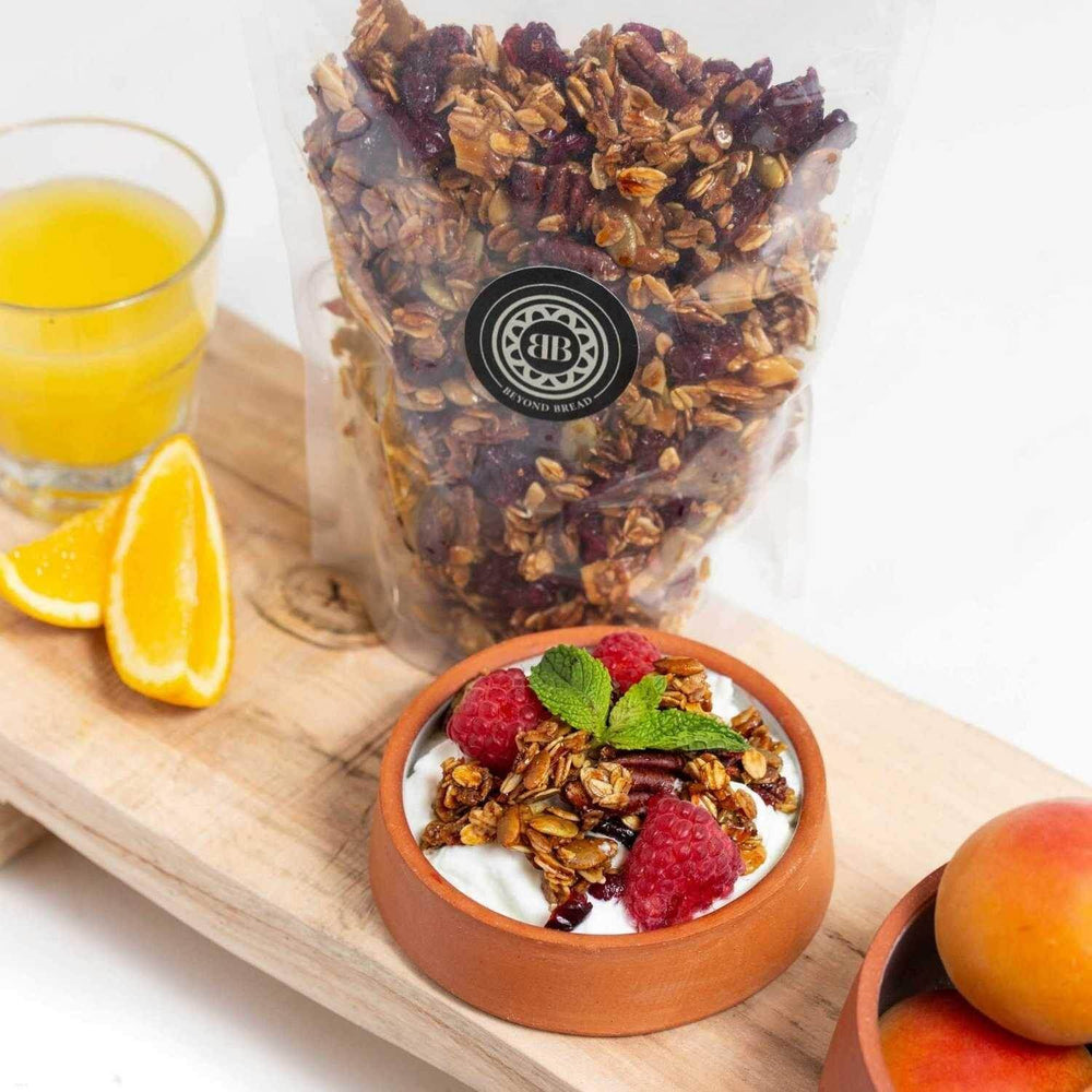
                  
                    Best quality fresh home made granola made with natural ingredients by master bakers at Beyond Bread Artisan Bakery and cafe. The texture is delightfully crunchy and sweet, which makes it a perfect breakfast companion to healthy yogurt. Crunchier than its cousin -muesli, our artisan quality granola is a natural source of protein.
                  
                